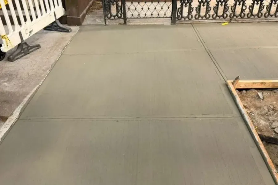 Freshly poured concrete after the violation repair in Brooklyn, sidewalk repair by Sidewalk Repair Near Me in NYC