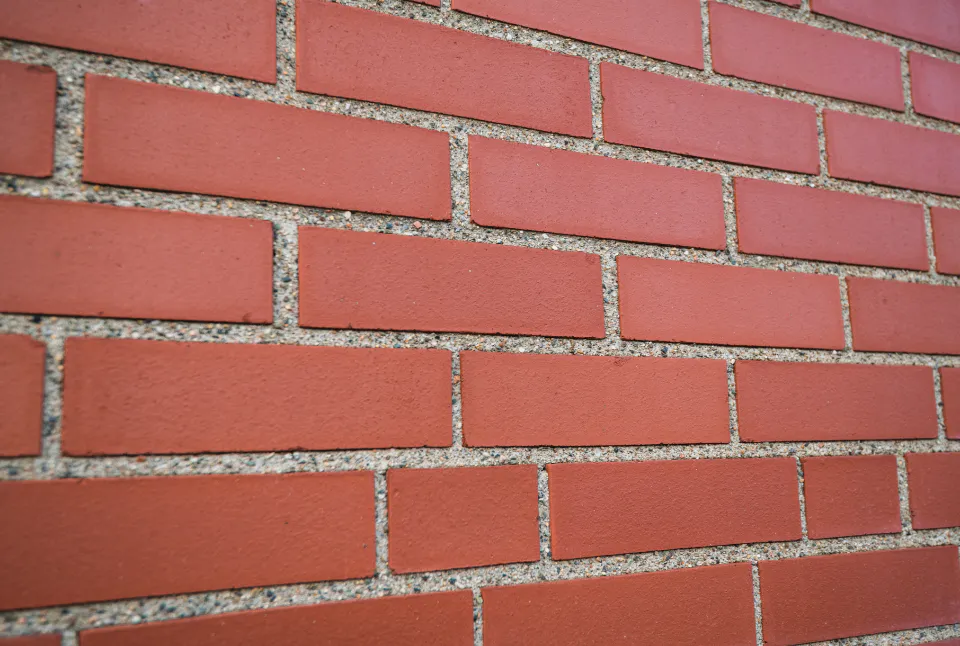 Smooth red brick laid in gray mortar