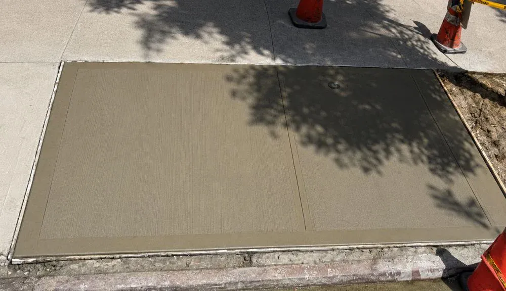 New concrete sidewalk flags poured in the East Village, Manhattan, concrete work by Sidewalk Repair Near Me in NYC