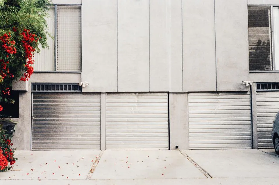 Concrete apron in front of a row of garage doors