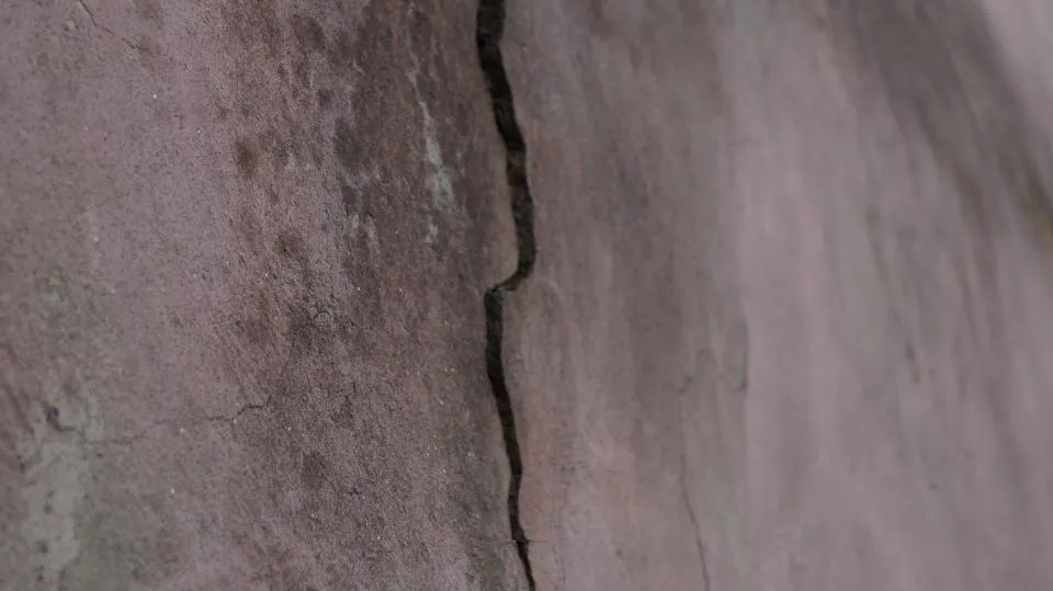 Crack running down a rendered wall