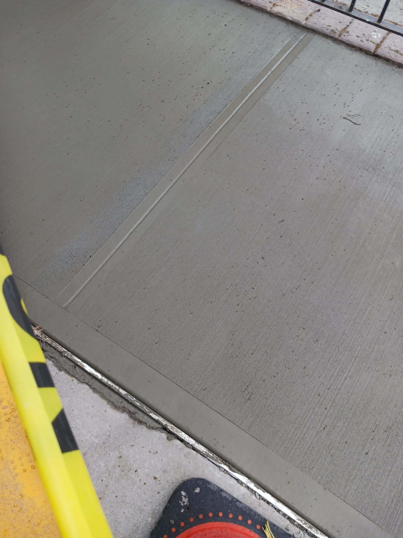 Broken curb in New York City requiring repair